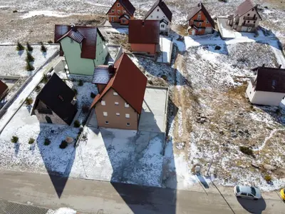 an overhead view of a town in the snow at Apartmani Čiča in Kupres