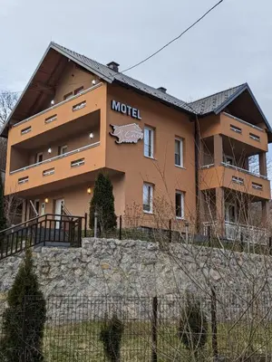 a building with a model sign on the side of it at Apartmani Di Casa Dreams in Donji Vakuf