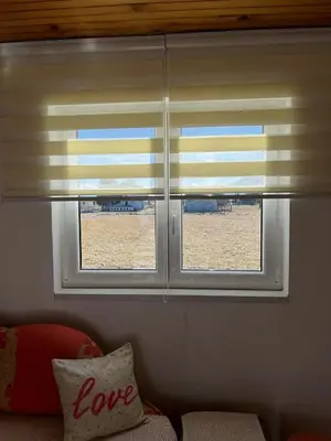 two windows with blinds in a living room at Kuca za odmor Marija in Kupres