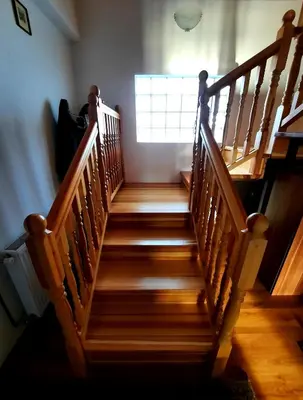 a set of wooden stairs in a room with a window at Kuća na dan Vrla strana in Bosansko Petrovo Selo