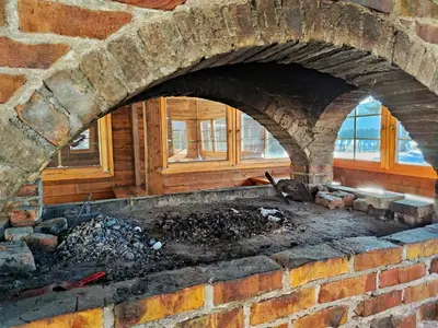 a brick oven with a fire inside of it at APARTMAN SNOW Vlašić in Vlasic