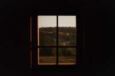 an open window with a view of a forest at Ranč Crna stina in Livno