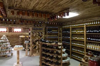 a room filled with lots of wine bottles at Malak Farma in Kakanj