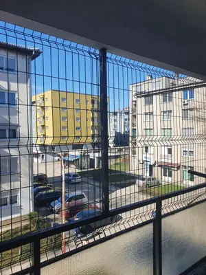 a view of a parking lot from a balcony at Diamond M Apartment in Bihać