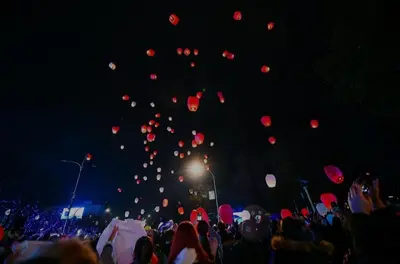 a group of balloons flying in the sky at night at Apartman MM , Banja Luka, Wi-Fi free,parking free in Banja Luka