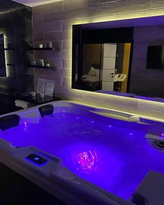 a large purple bath tub in a room at Spa Intimo Doboj in Doboj