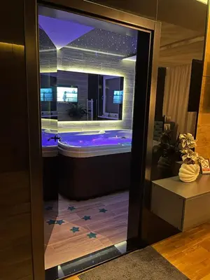 a bathroom with a jacuzzi tub in a building at Spa Intimo Doboj in Doboj