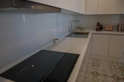 a kitchen with a sink and a counter top at Penthouse Linnet Bihać in Bihać