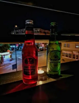 two bottles of beer are sitting on a table at LNB Lux in Doboj