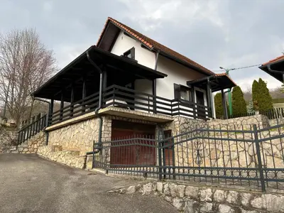 a house with a fence in front of it at Vikendica Mlinovi in Krupa na Vrbasu