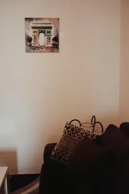a living room with a couch and a picture on the wall at Apartman Archive Jevrejska in Banja Luka