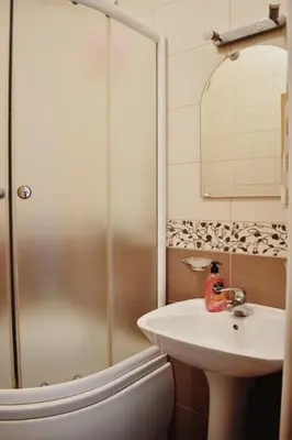 a bathroom with a shower and a sink at Apartman Archive Jevrejska in Banja Luka