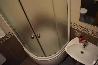 a bathroom with a shower and a sink at Apartman Archive Jevrejska in Banja Luka