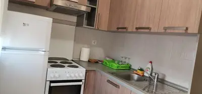 a kitchen with a sink and a stove top oven at Apartman Benz studio in Banja Luka
