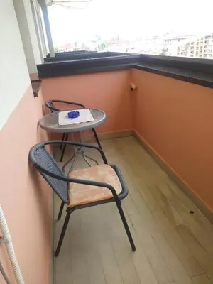 a table and chairs in a room with a window at Apartman Benz studio in Banja Luka