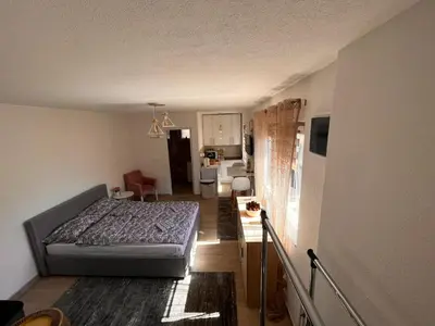 a small bedroom with a bed in a room at City apartment 2 in Visoko