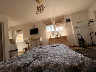 a bedroom with a large bed in a room at City apartment 2 in Visoko