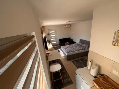 a small room with a bedroom and a bed at City apartment 2 in Visoko