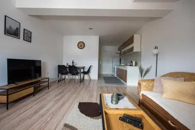 a living room with a couch and a table at Apartman Luca in Livno