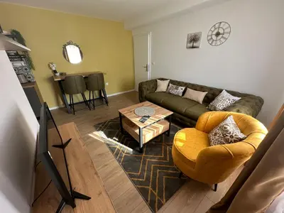 a living room with a couch and a table at Apartman Anđela in Livno