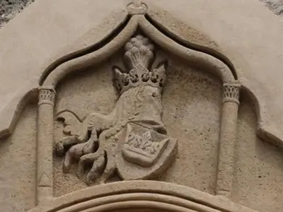 a building with a crest on the side of it at NETWORK apartment in Jajce