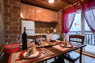a kitchen with a table with food on it at Villa Ela in Kupres