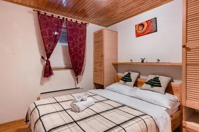 a bedroom with a bed and a window at Villa Ela in Kupres