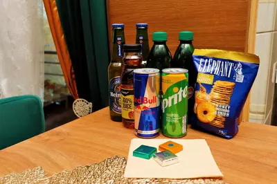 a table with several bottles of beer and a card at Elegant Visoko in Visoko