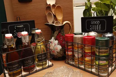 a table with three baskets filled with bottles of food at Elegant Visoko in Visoko