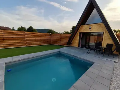 a swimming pool in the backyard of a house at Villa Dream House Bihac in Bihać