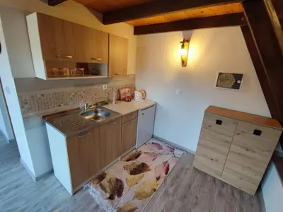 a small kitchen with a sink and a counter at Villa Dream House Bihac in Bihać
