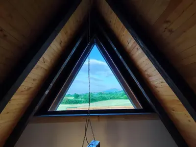 a window in a cabin with a swing at Villa Dream House Bihac in Bihać