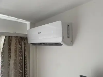 a microwave oven hanging from a ceiling in a room at Studio Apartman Centar in Zenica