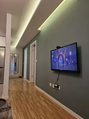 a living room with a flat screen tv on a wall at Nika in Banja Luka