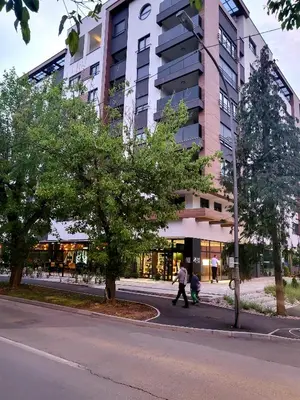a man walking down a street in front of a building at Nika in Banja Luka