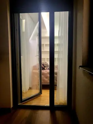a view of a room through a glass door at Nika in Banja Luka