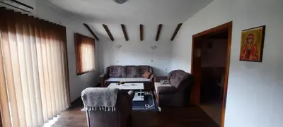 a living room with two couches and a table at Smjestaj na selu Stankovic - Pliva in Šipovo