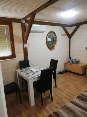 a dining room with a table and chairs at Flora&Fauna in Bihać
