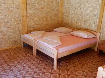 a small bed with two pillows on it in a room at Flora&Fauna in Bihać
