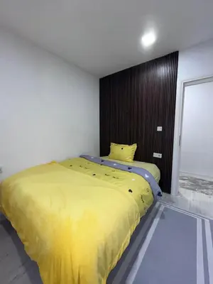 a bedroom with a large yellow bed in it at Sunset Delux Apartment in Visoko
