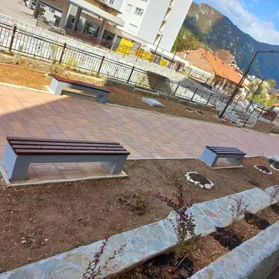 a park bench sitting on top of a patio at Apartment Aria in Travnik