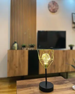 a glass candle holder on a table in a room at Apartman Sunshine in Doboj