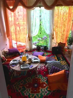 a living room with a table and a couch at Riverside Plaza in Bihać