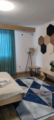 a room with a bed and a rug on the floor at Motel 