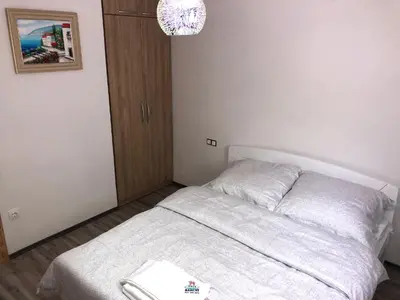 a bedroom with a bed with a book on it at Motel 