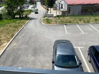 a car parked in a parking lot at New Apartment in the City in Visoko
