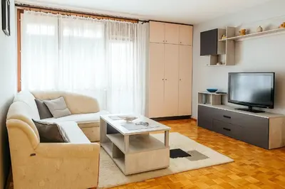 a living room with a couch and a tv at Apartman Centar Banja Luka in Banja Luka
