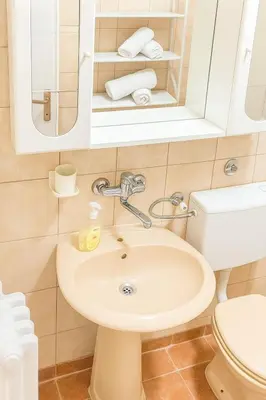 a bathroom with a sink and a toilet at Apartman Centar Banja Luka in Banja Luka