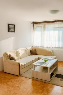 a living room with a couch and a coffee table at Apartman Centar Banja Luka in Banja Luka