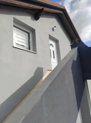 a house with a window and a ramp leading up to it at Prenoćište Ljiljana 2 in Livno